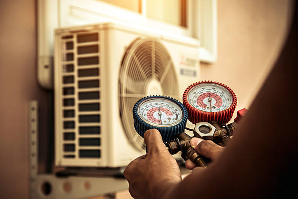 Professional Air Conditioning Service technician working in Beaverton, MI